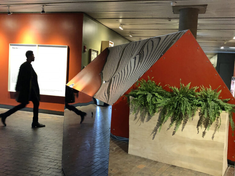 The lobby of a GSD building, lots of ferns and scultpures